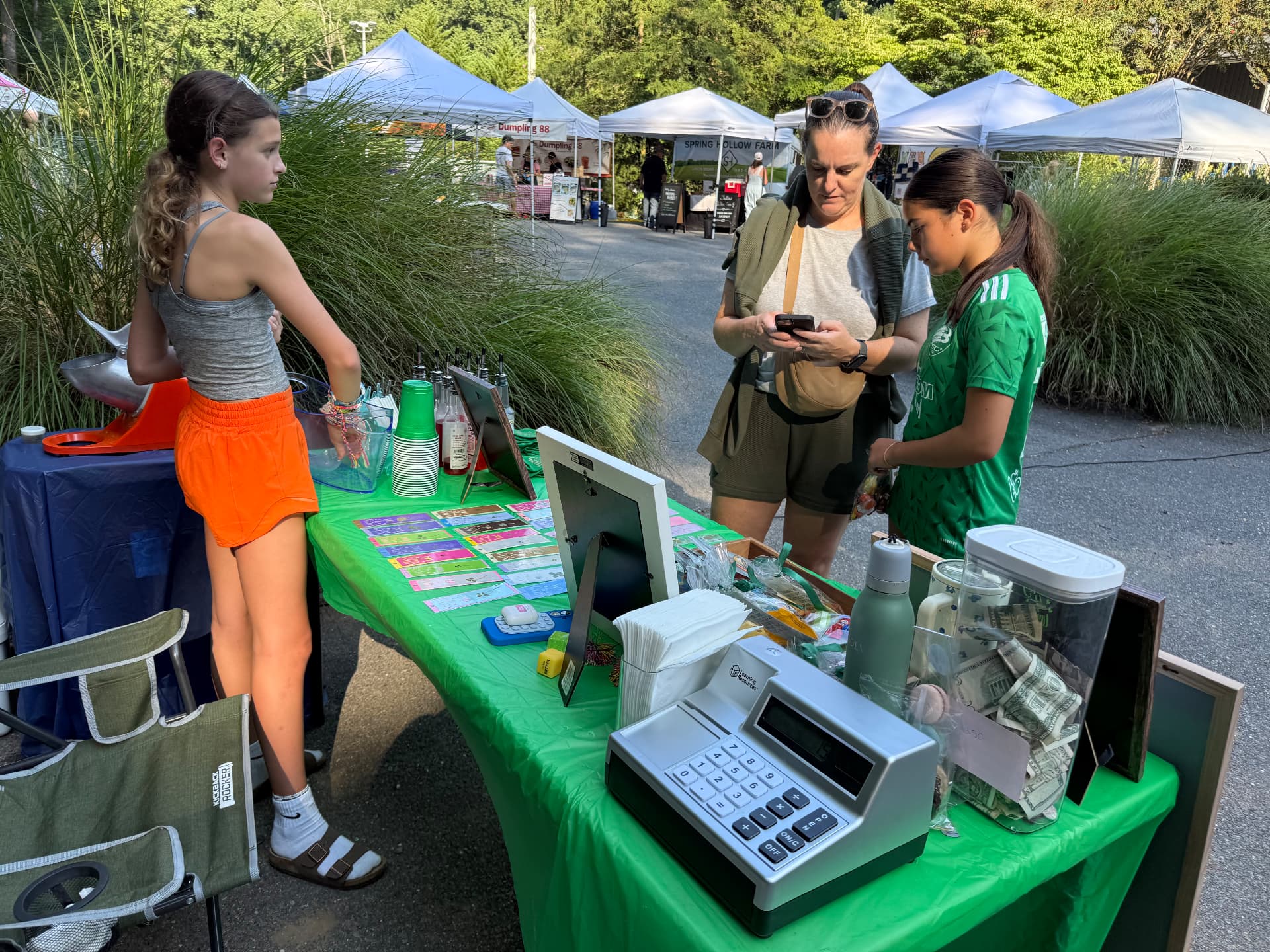 The Lucky4Love stand at the Carderock Market with customers browsing
