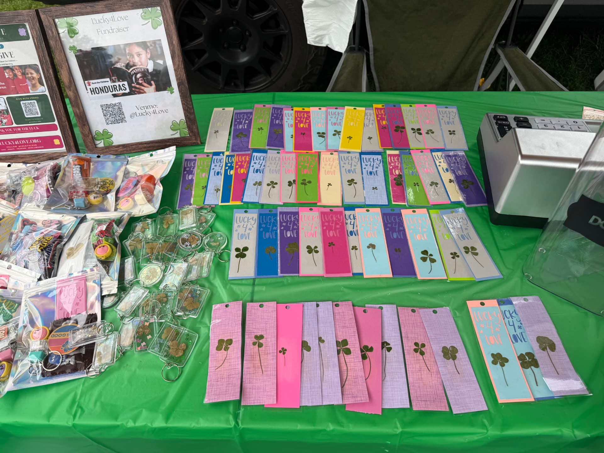 Rows of pressed four-leaf clover bookmarks and keychains for sale