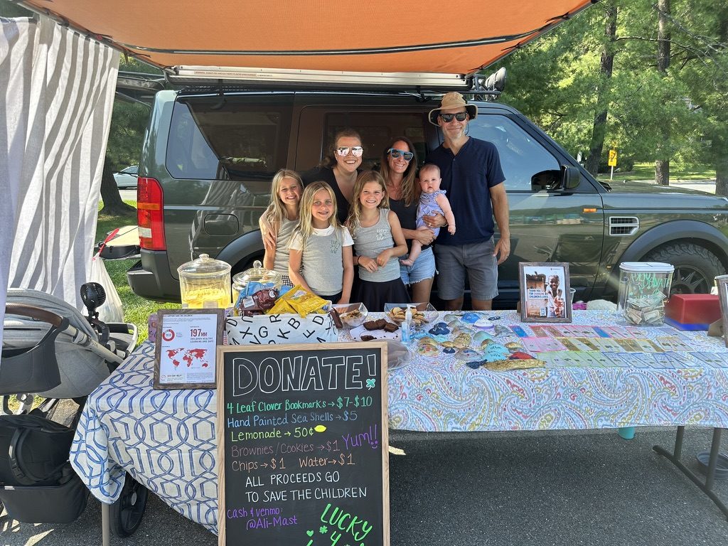 Friends and family working the Lucky4Love fundraiser stand together